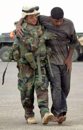 Marine helping Iraqi...