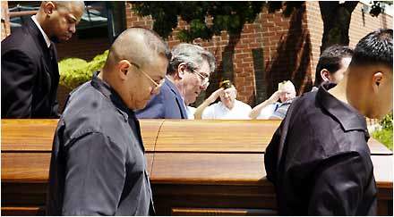 Pallbearers Carry th...