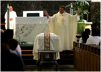 Priest Says Mass...