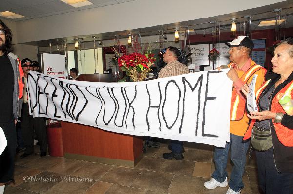 protesters hold thei...