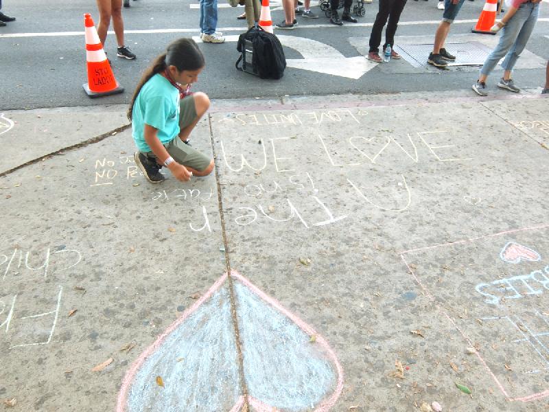 Girl Chalking Sidewa...