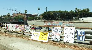 Signs Attached to the Freeway Rails