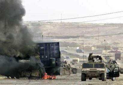 Iraq Bombings Kill 6...